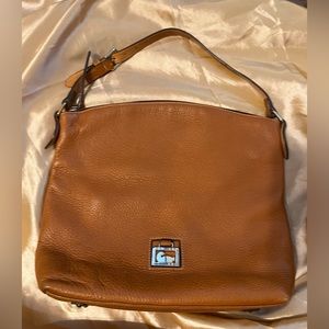 Dooney & Bourke Bag color Brown, w/ dust bag. Size 11x14x4. Gently used.